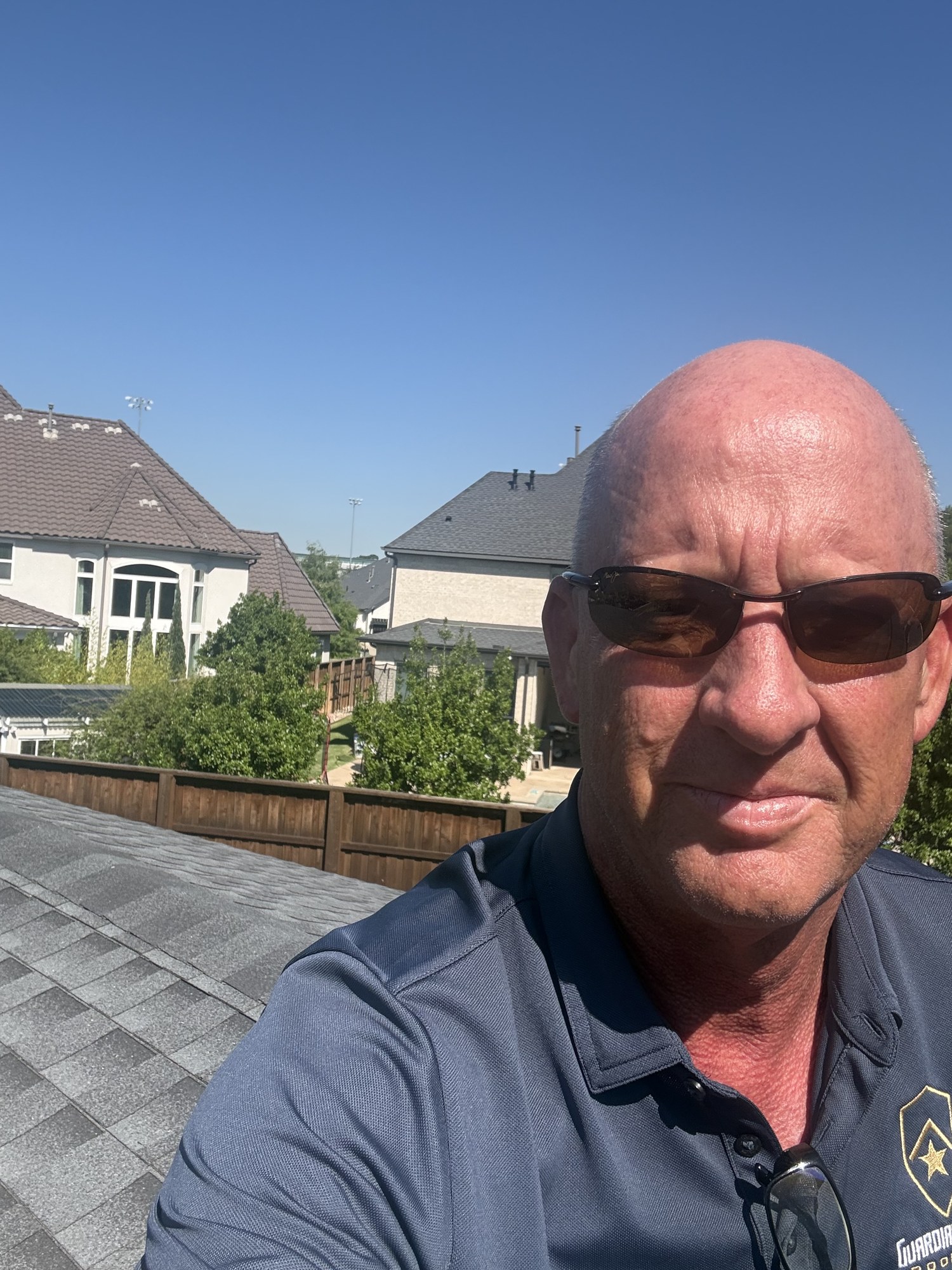 Guardian Ridge Roofing team member on a residential roof during a project in the DFW metroplex
